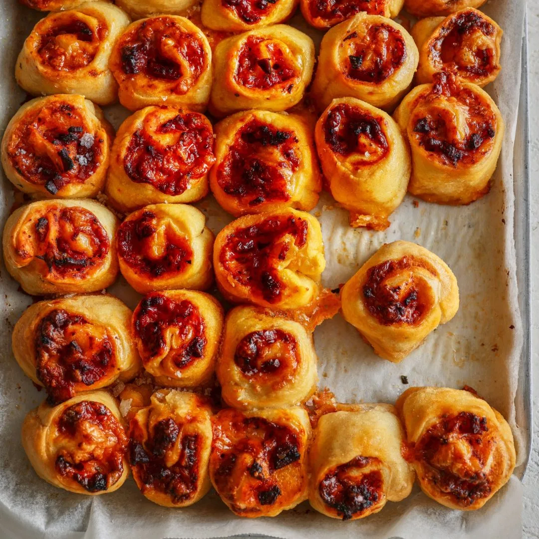 tray of mini savoury scrolls with pepperoni