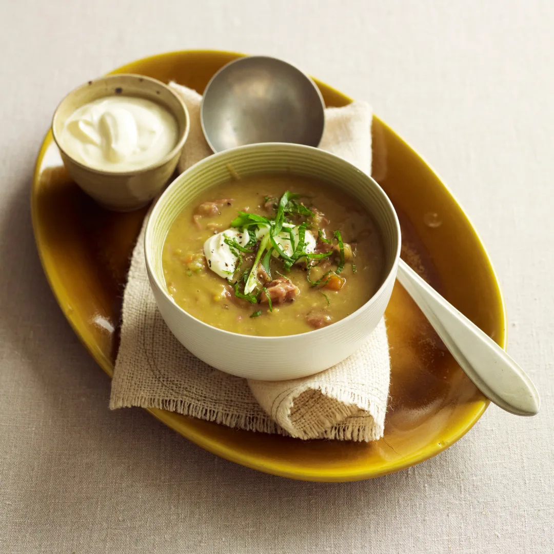 A bowl of pea and ham soup