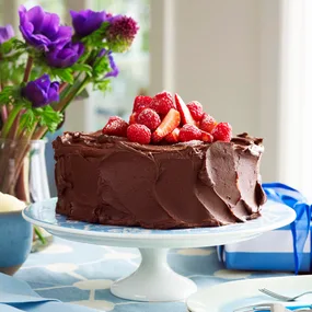 Julie Goodwin's chocolate ganache cake covered in chocolate ganache icing and topped with berries