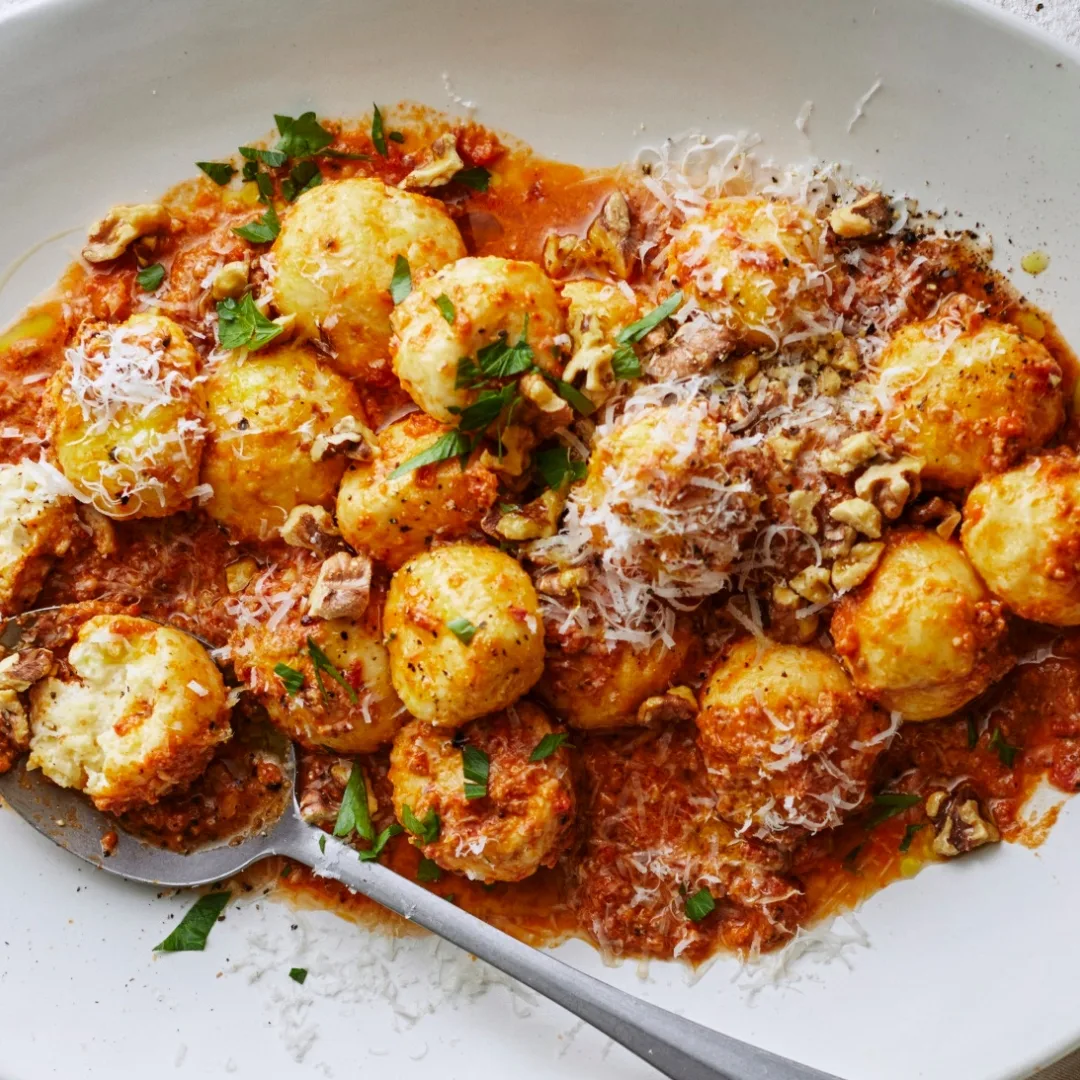 Ricotta gnudi in romesco with parmesan