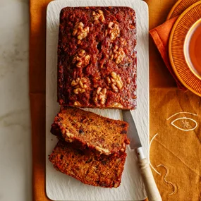 carrot and dates cake with two slices cut