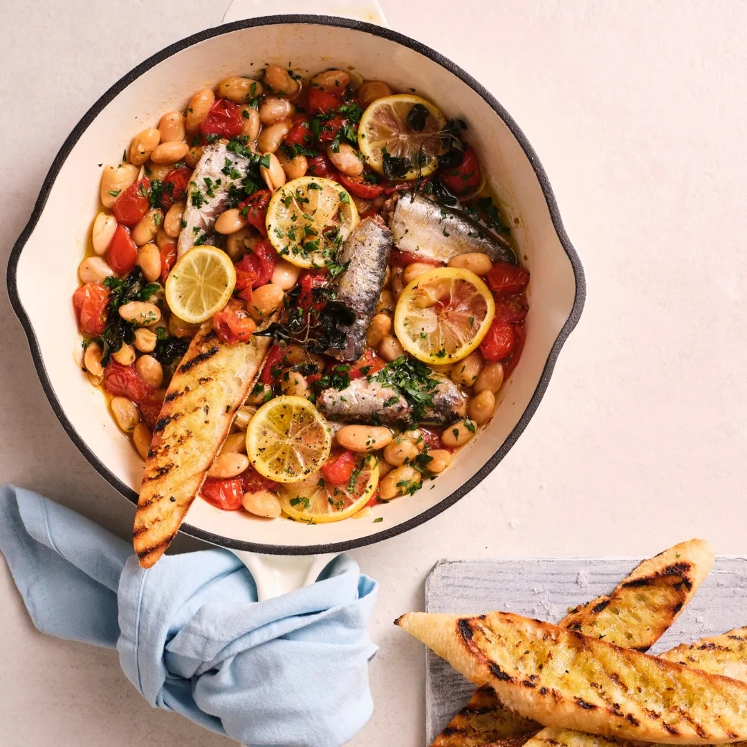 easy mexican beans with canned sardines in a frying pan
