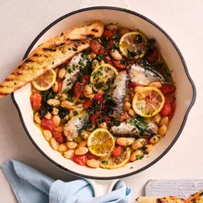 easy mexican beans with canned sardines in a frying pan; recipe below