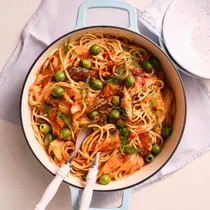 sardine & fennel spaghetti in a pot with serving utensils