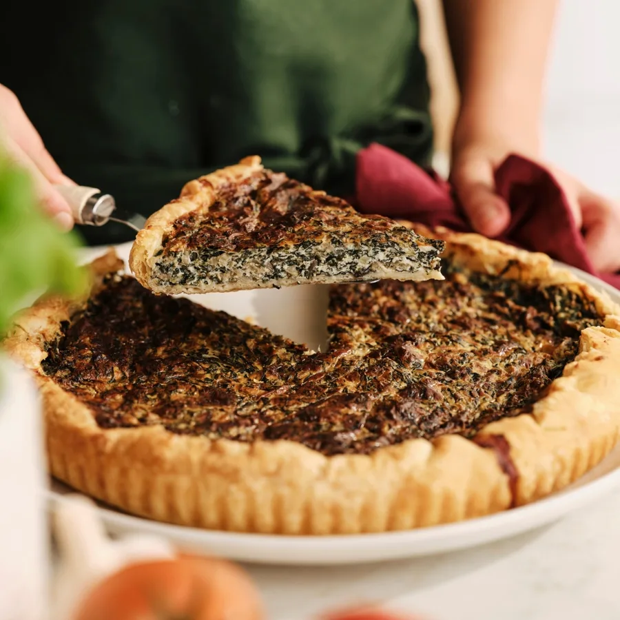 silverbeet and ricotta pie with a slice cut out