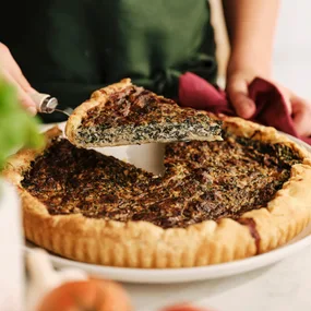 silverbeet and ricotta pie with a slice cut out