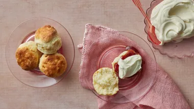 small batch baking; four scones with a bowl of cream