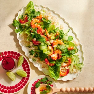 Coconut rice & prawn salad with sesame-chilli dressing on an oval platter