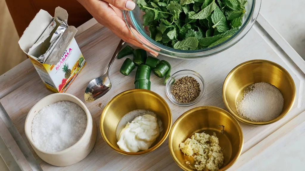 bowls of ingredients for a green chutney whole roast chicken marinade