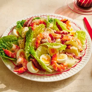 Prawn & potato Caesar salad on a plate
