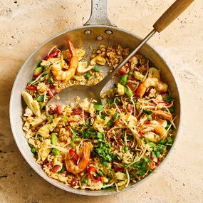 Overhead view of a skillet filled with special fried rice