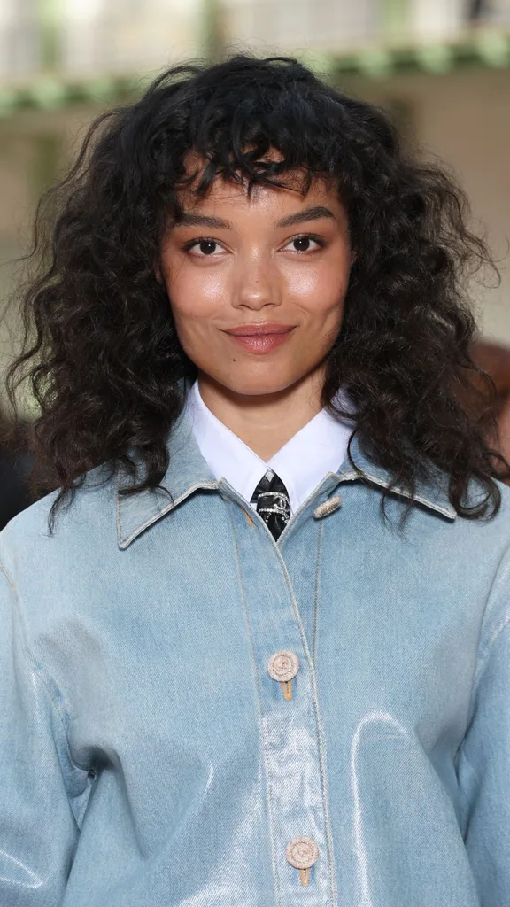 Whitney Peak Choppy curly fringe style