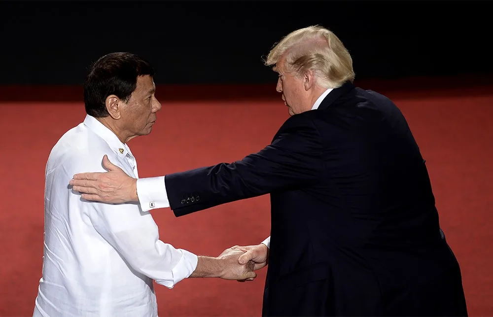 Philippine President Rodrigo Duterte shakes hands with US President Donald Trump