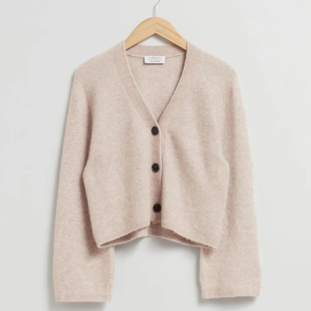 Beige cardigan. 