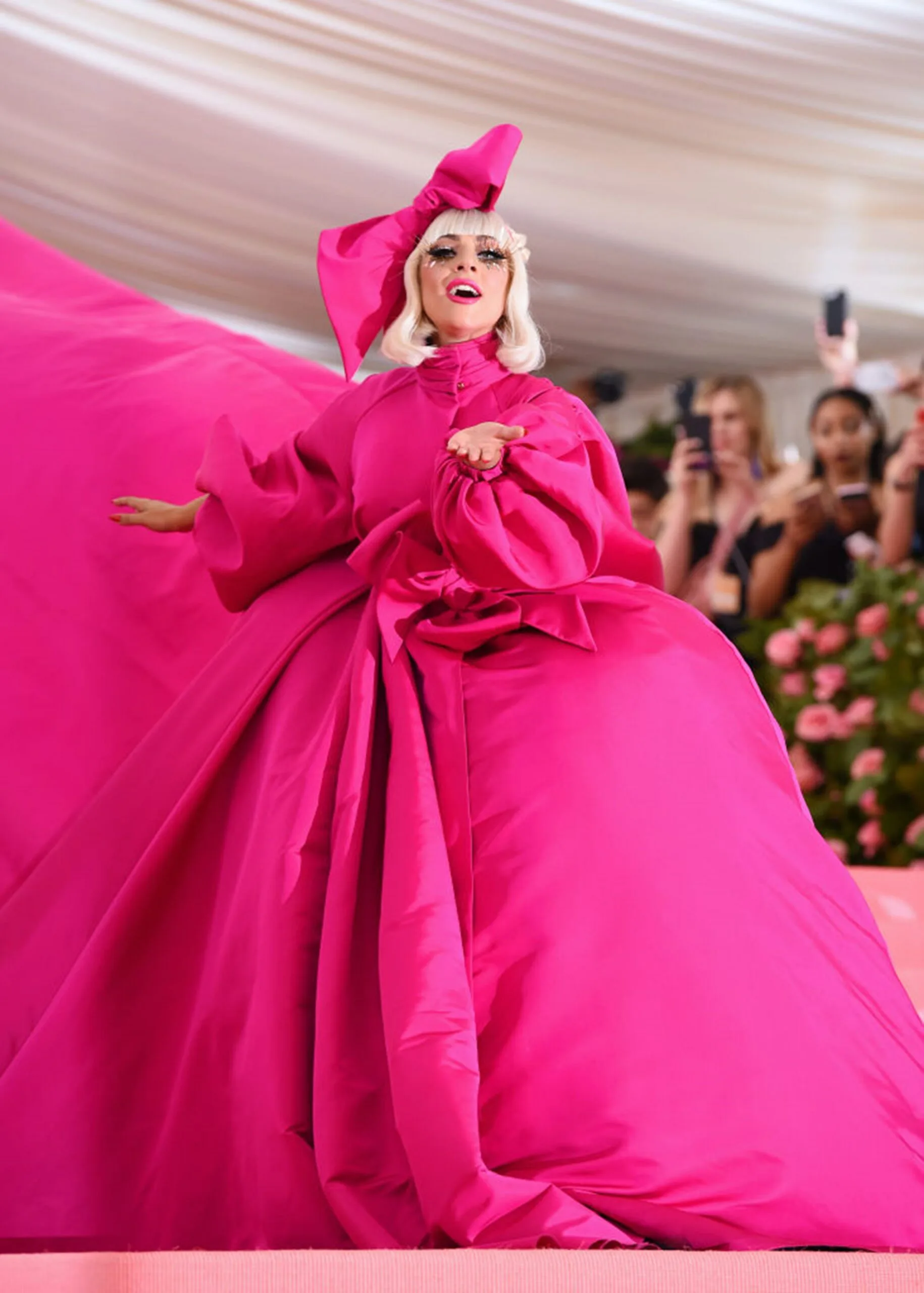 lady gaga at the 2019 met gala in the first of four looks, a giant pink ball gown coat
