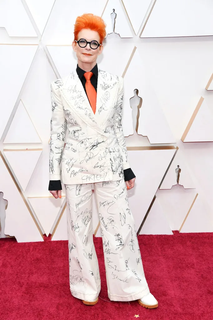 Costume designer Sandy Powell wore a suit autographed by Hollywood's elite