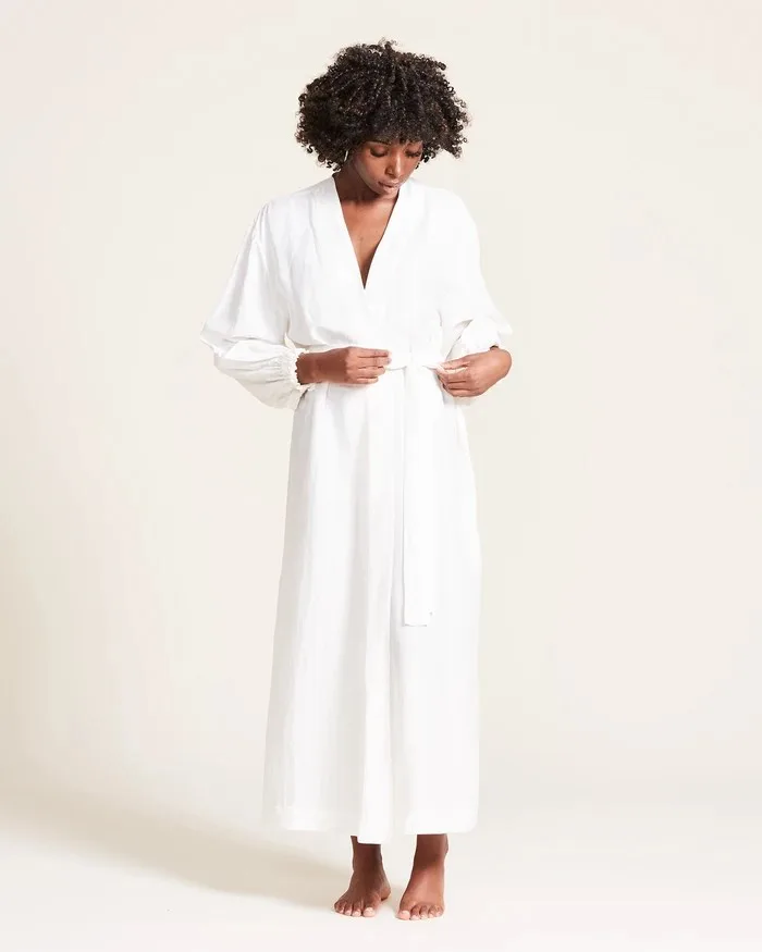 Black woman wearing white robe