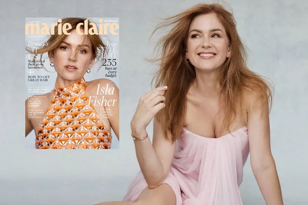 "Isla Fisher smiling in a pink dress next to her Marie Claire magazine cover."