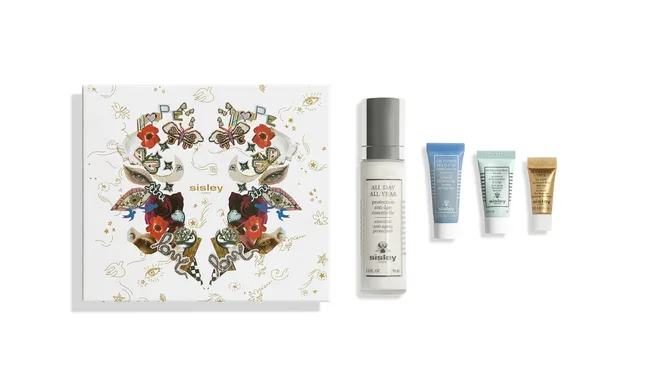 Sisley Paris gift box with floral art and four skincare products including All Day All Year bottle.
