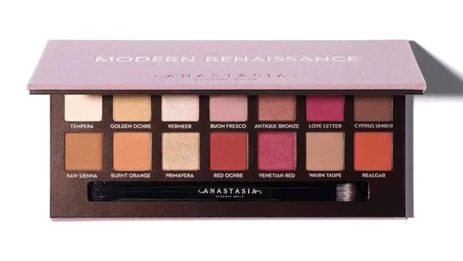 Anastasia Beverly Hills Modern Renaissance eyeshadow palette with 14 shades and a brush.