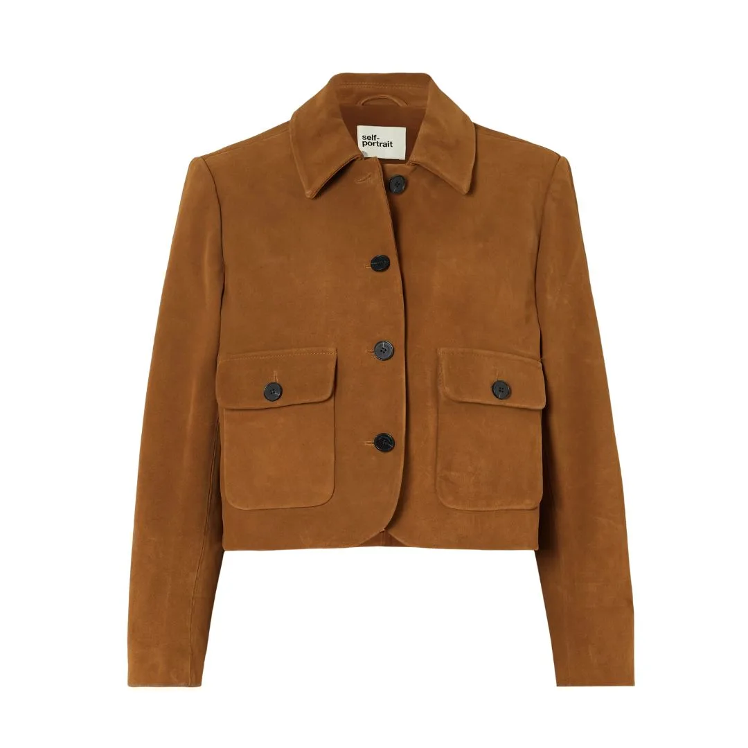 model wears a brown suede jacket