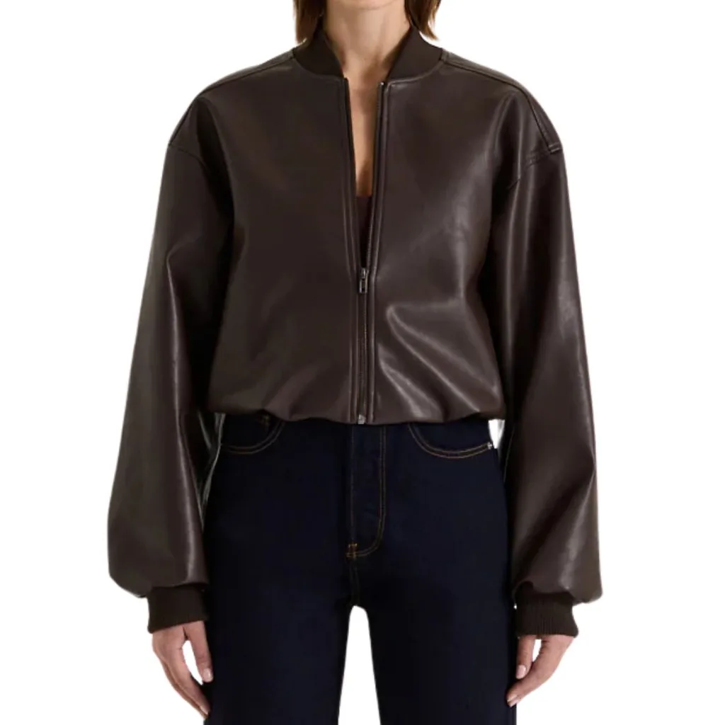 a female model wears a brown leather jacket
