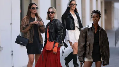 four women wear leather jackets of varying styles captured by a street style photographer