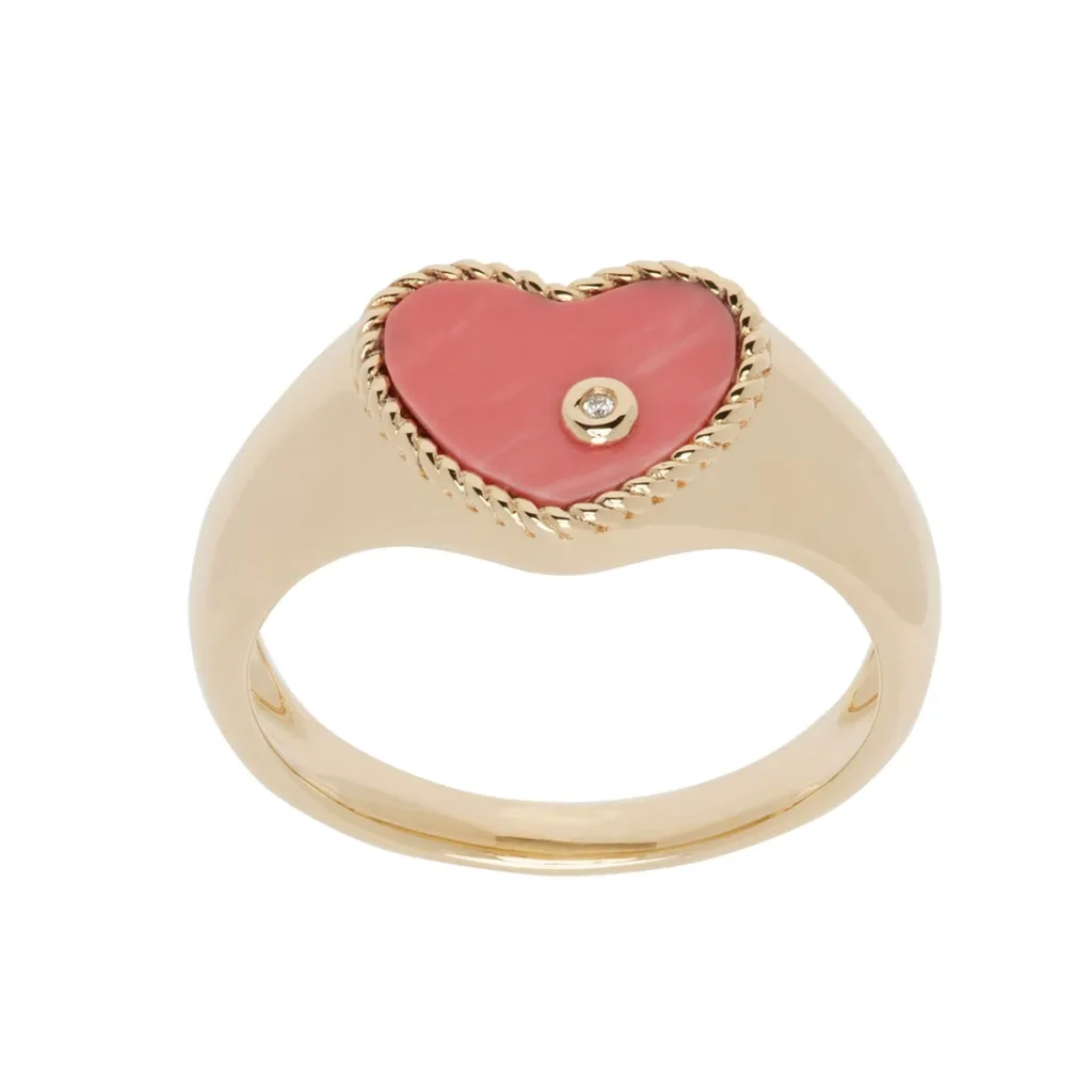 This piece from Parisienne fine jeweller Yvonne Léon balances sweetness with sophistication, featuring a peachy coral piece bezel set in a 9-karat gold band with a 0.003-carat diamond off center and circled with gold.