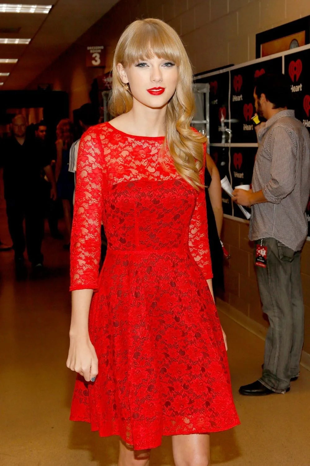 Taylor Swift wearing a red dress during her era of the same name, around 2012.