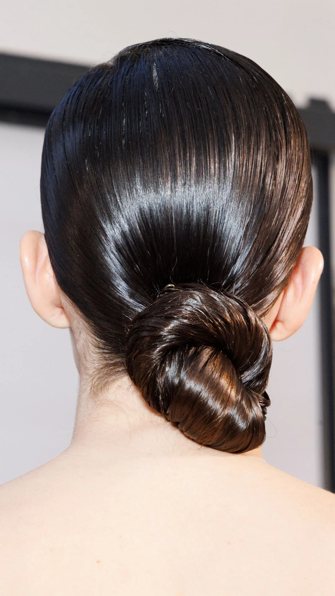 A model , hair detail, is seen backstage at the Elisabetta Franchi fashion show