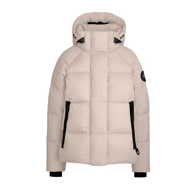 Beige puffer jacket with a hood and black zippers, featuring a patch on the sleeve.