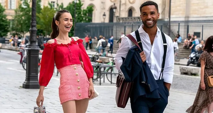 Lily Collins as Emily and Lucien Laviscount as Alfie in Emily in Paris.