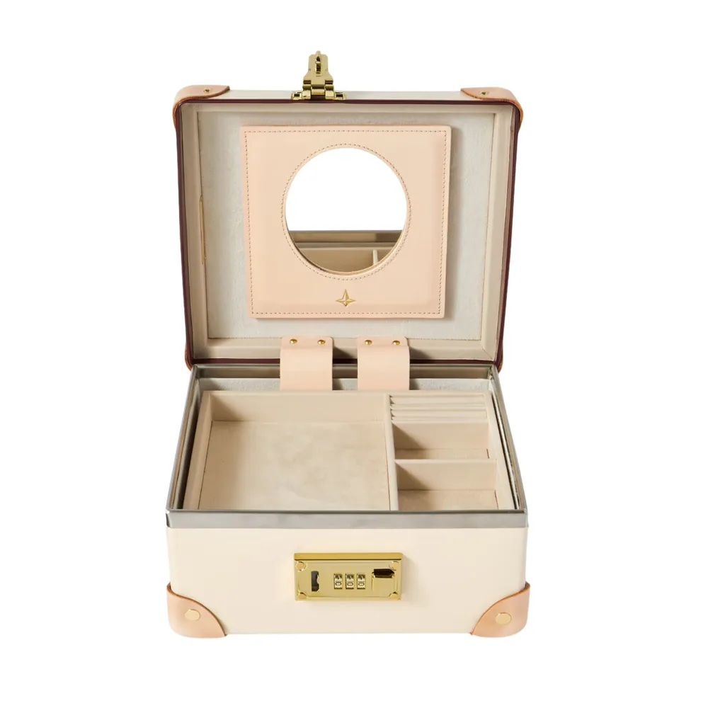 Globe-Trotter Safari Leather-Trimmed Jewellery Case in ivory features a combination lock and removable tray to make room for more of your precious items. 