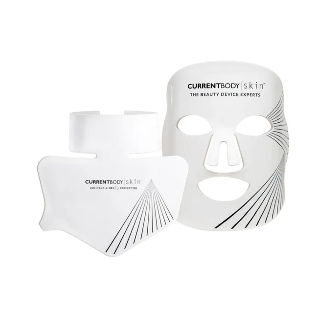 PAIR of white LED face and neck masks branded "CURRENTBODY skin," featuring linear design accents.
