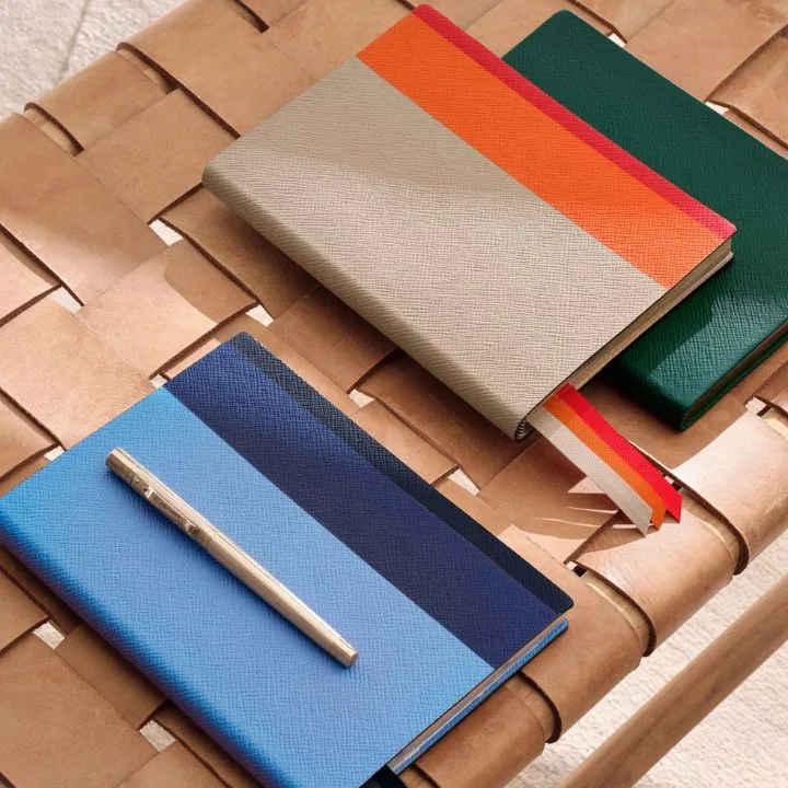 Smythson are a luxury bag lable that have dipped their toes into the world of stationery and home office supplies. Featured are their dual toned leather bound notebooks. 