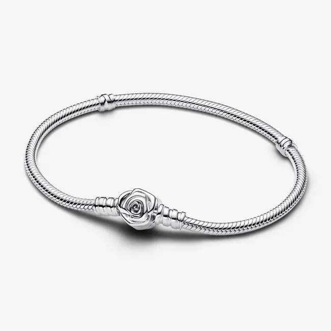 Silver snake chain bracelet with a detailed rose clasp on a plain white background.