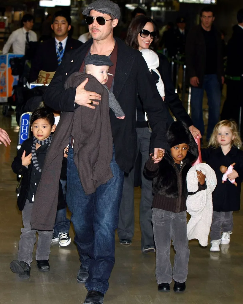 Brad Pitt and Angelina Jolie arrive at Narita International Airport with their children (L to R) Pax Thien, Knox, Zahara and Shiloh on January 27, 2009 in Narita, Chiba, Japan.