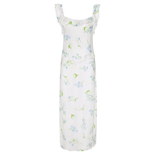 White floral dress with blue and green flower patterns and ruffled straps.