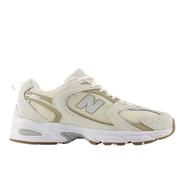 White and beige New Balance sneaker with mesh panels and "N" logo on the side.