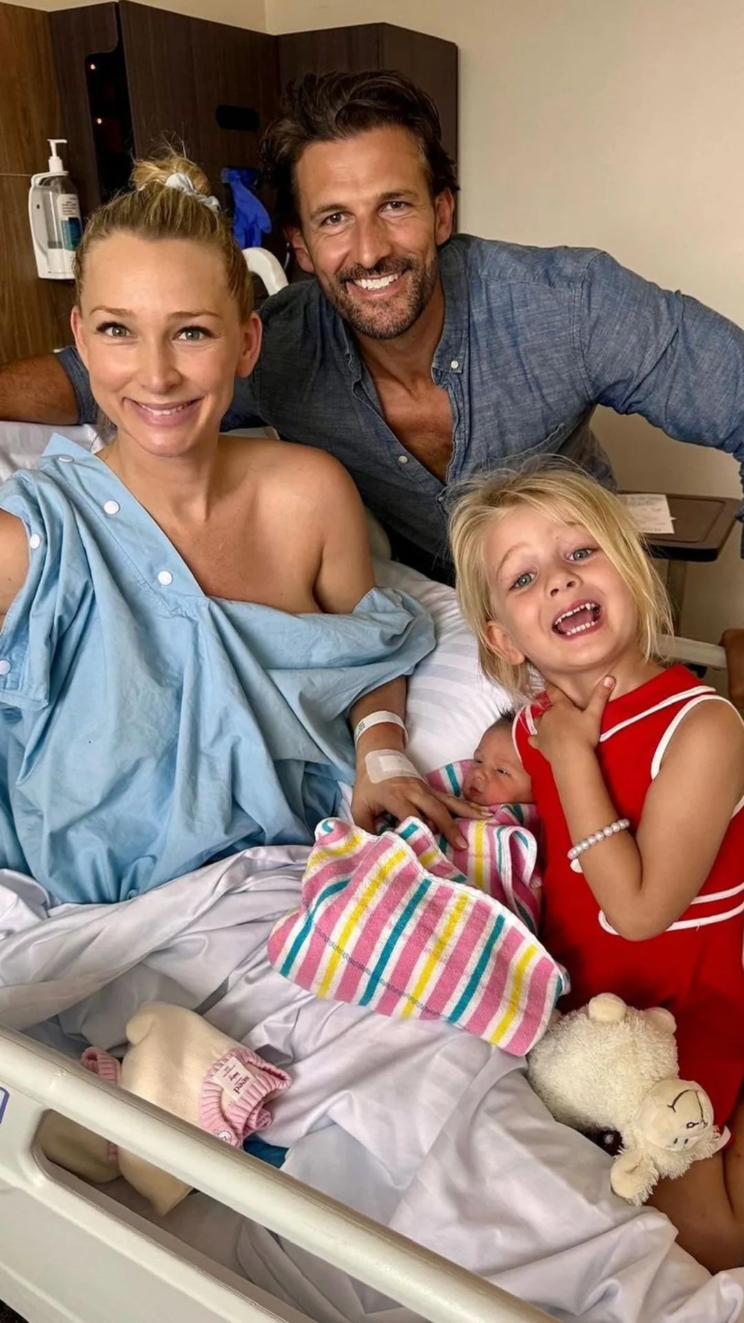 tim robards and anna heinrich from the bachelor australia season 1, who are still together, pose with their two daughters