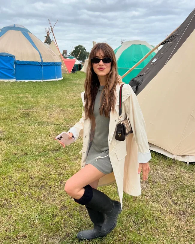 daisy edgar jones at glastonbury festival in gumboots and grey mini dress
