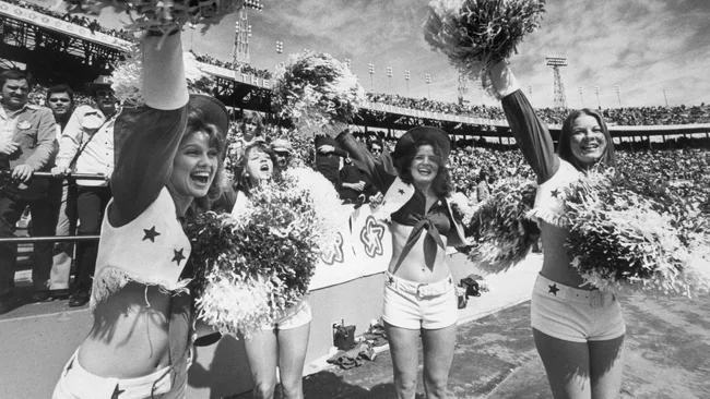four dallas cowboys cheerleaders cheer for their team in the 1976 Super Bowl in Miami