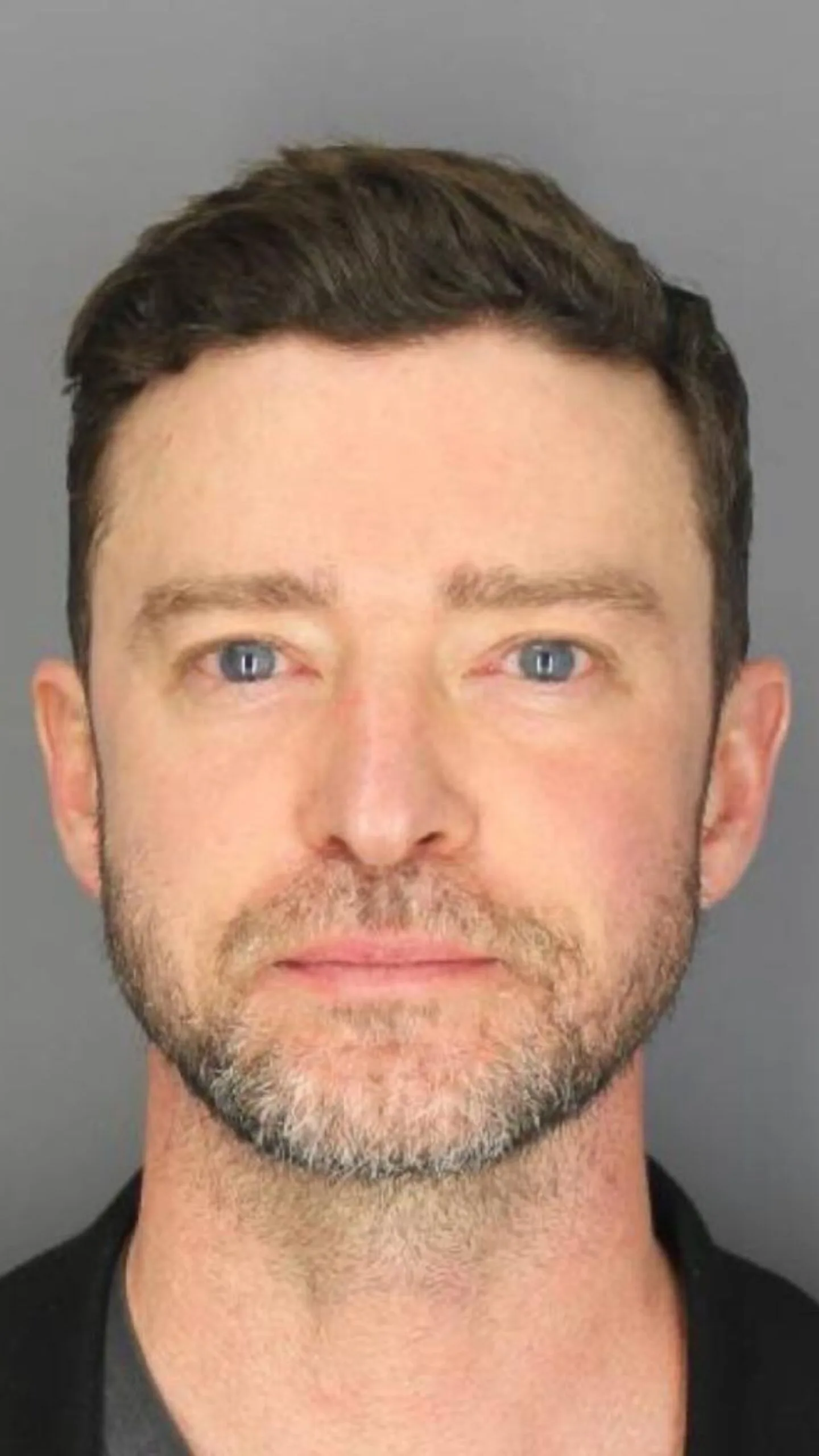 justin timberlake poses for a mug shot after being arrested