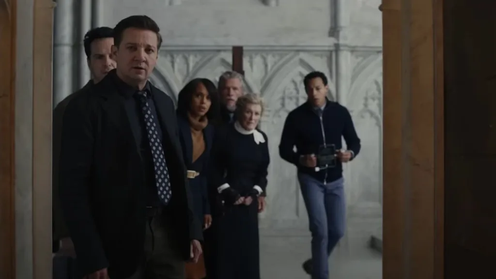 A group of people staring through a doorway acting surprised.