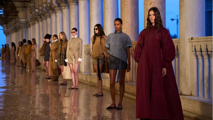 Models line up at the max mara resort 25 show.
