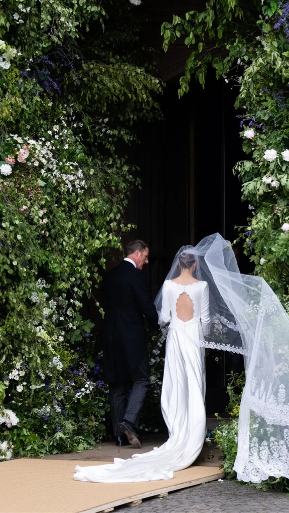 Olivia entering the church with her father. 