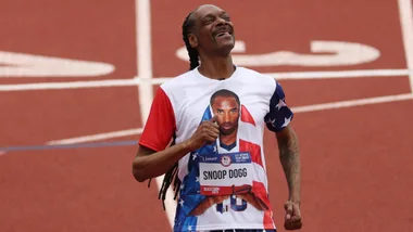 snoop dogg runs on a track at the US 2024 paris olympics track and field trials