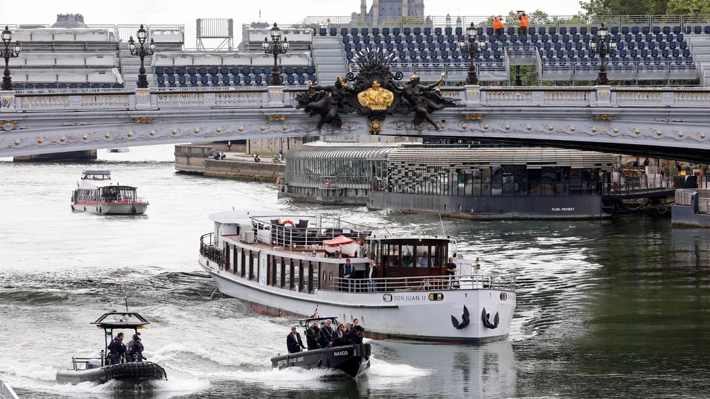 the seine river with boats in it ahead of the 2024 paris olympics opening ceremony