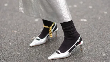 Close-up detail view of silver kitten heels pointed shoes, a gold ankle chains, outside Gauchere, during the Womenswear Fall/Winter 2024/2025 as part of Paris Fashion Week on February 29, 2024 in Paris, France. (Photo by Edward Berthelot/Getty Images)