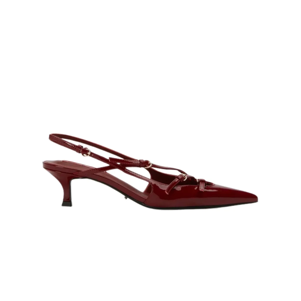 Tony Bianco Koko Heel is a burgundy slingback kitten heel with a pointed toe and multiple buckles.